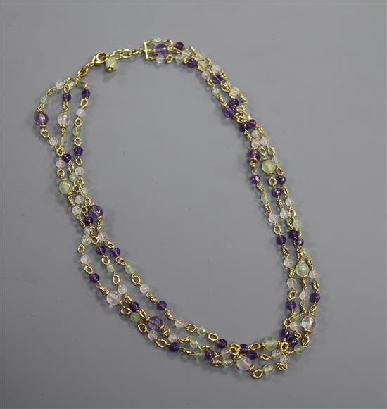 A modern 18ct gold and gem set triple strand necklace, approx. 43cm.